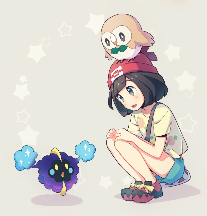 1girl bag bangs beanie black_hair blush commentary_request cosmog eyebrows_visible_through_hair eyelashes gen_7_pokemon green_shorts hands_on_own_knees hat kurochiroko legendary_pokemon looking_down open_mouth pokemon pokemon_(creature) pokemon_(game) pokemon_sm red_headwear rowlet selene_(pokemon) shirt shoes short_hair short_sleeves shorts shoulder_bag squatting star_(symbol) tongue upper_teeth yellow_shirt