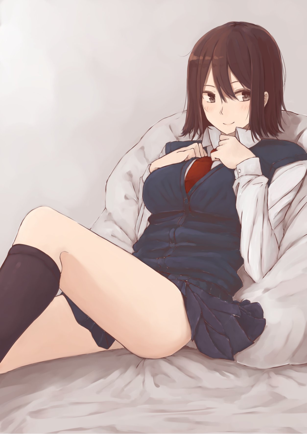 1girl black_legwear black_skirt blue_vest blush bob_cut breast_suppress brown_eyes brown_hair closed_mouth collared_shirt feet_out_of_frame hands_up highres knee_up long_sleeves looking_at_viewer medium_hair necktie original pillow pleated_skirt reclining red_neckwear rucchiifu shirt sitting skirt smile socks solo vest white_shirt wing_collar