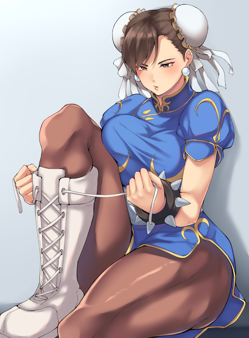 1girl black_mutou blue_background blue_dress blush boots bracelet breasts brown_eyes brown_hair brown_legwear bun_cover china_dress chinese_clothes chun-li cross-laced_footwear double_bun dress earrings gradient gradient_background jewelry lips medium_breasts pantyhose pelvic_curtain puffy_short_sleeves puffy_sleeves sash shoelaces short_sleeves sitting solo spiked_bracelet spikes street_fighter white_footwear