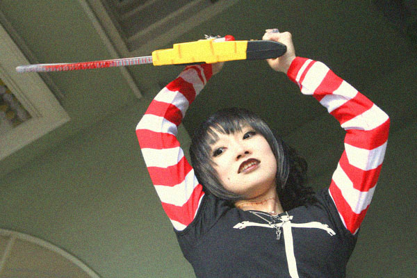 asian black_lagoon chainsaw cosplay female girl omi_gibson photo plaid pleated_skirt sawyer_the_cleaner striped women