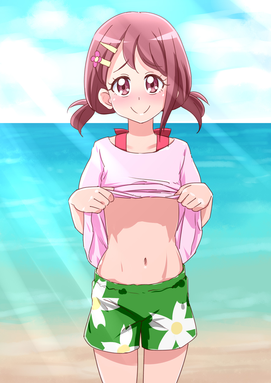 1girl asymmetrical_bangs bangs bare_legs beach belly blush brown_hair collarbone commentary_request cowboy_shot day floral_print flower green_shorts hair_flower hair_ornament hairpin hanadera_nodoka healin'_good_precure highres light_rays navel nose_blush ocean outdoors pink_eyes pink_shirt precure rin_takanashi_glacies sand shiny shiny_skin shirt shirt_lift short_hair short_twintails shorts smile solo stomach toned twintails