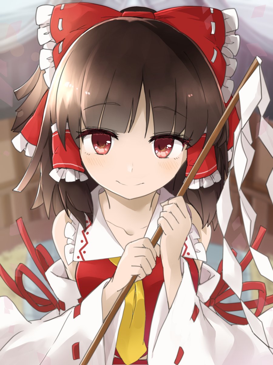 1girl ascot bangs bow brown_hair closed_mouth detached_sleeves eyebrows_visible_through_hair frilled_bow frilled_hair_tubes frills gohei hair_bow hakurei_reimu highres holding looking_at_viewer medium_hair nontraditional_miko red_bow red_eyes red_ribbon red_shirt ribbon ribbon-trimmed_bow ribbon-trimmed_sleeves ribbon_trim shirt smile solo touhou tyouseki upper_body white_ribbon wide_sleeves yellow_neckwear