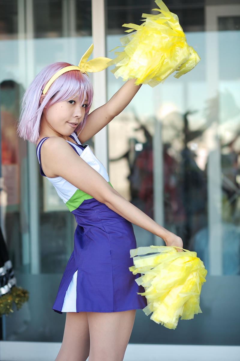 cheerleader cosplay hair_bow hiiragi_tsukasa lucky_star maritsuki_haru photo pom_poms purple_hair