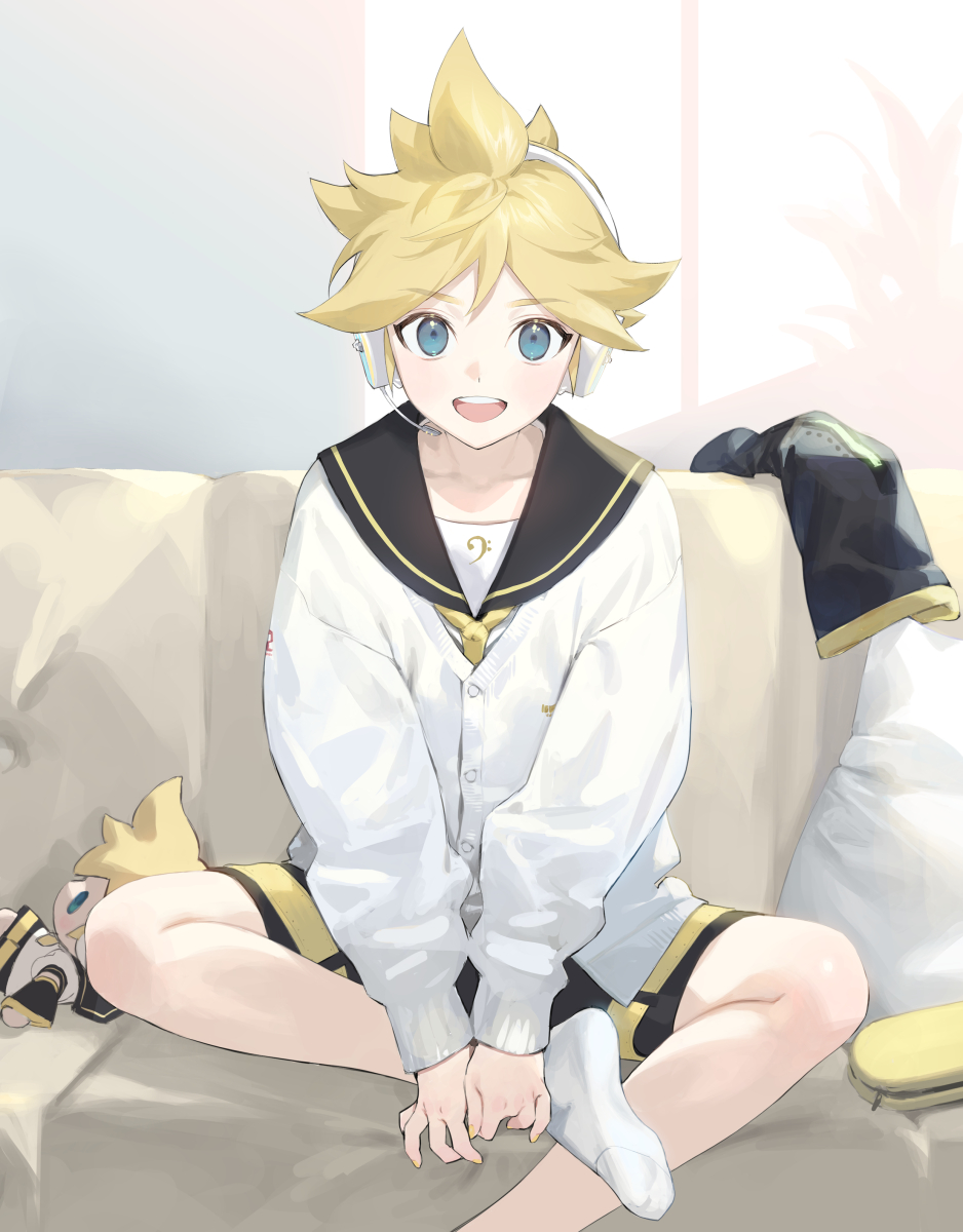 1boy bass_clef black_sailor_collar black_shorts black_sleeves blonde_hair blue_eyes cardigan character_doll commentary couch cushion detached_sleeves headphones headset highres holding_own_foot indoors kagamine_len looking_at_viewer male_focus musical_note musical_note_print naoko_(naonocoto) on_couch open_mouth sailor_collar shorts sitting sleeves_removed smile socks solo spiky_hair vocaloid white_socks