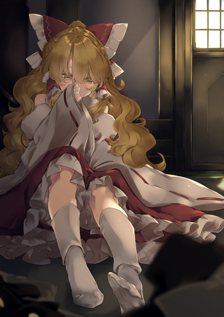 1girl bangs blonde_hair blurry blurry_foreground blush bow commentary_request cosplay covering_mouth day eyebrows_behind_hair feet frilled_bow frilled_hair_tubes frills hair_between_eyes hair_bow hair_tubes hakurei_reimu hakurei_reimu_(cosplay) hand_up highres indoors kirisame_marisa kneehighs long_hair looking_down meji_aniki petticoat red_bow red_skirt red_vest ribbon-trimmed_sleeves ribbon_trim sidelocks skirt solo touhou very_long_hair vest wavy_hair white_legwear wide_sleeves window yellow_eyes