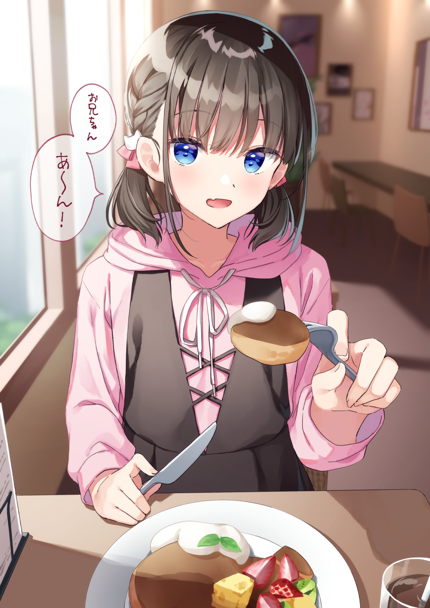 1girl bangs black_hair blue_eyes blush cat_hair_ornament commentary_request eyebrows_visible_through_hair fang fork hair_ornament highres holding holding_fork holding_knife hood hood_down hoodie incoming_food indoors knife long_sleeves looking_at_viewer muninshiki open_mouth original pink_hoodie plate short_hair short_twintails skin_fang solo table translation_request twintails