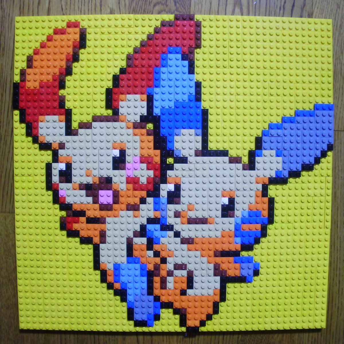 :d closed_mouth gen_3_pokemon highres lego lego_(medium) looking_to_the_side minun no_humans open_mouth photo_(medium) pixel_art plusle pokemon pokemon_(creature) simple_background smile unconventional_media yellow_background you_rei_(blowback)