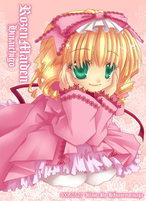 1girl artist_name blonde_hair blush bow character_name closed_mouth coat commentary_request copyright_name dated dress drill_hair full_body green_eyes hair_bow hands_on_own_cheeks hands_on_own_face hinaichigo kneeling lace-trimmed_bow lace_trim long_sleeves looking_at_viewer medium_bangs medium_hair morinaga_hinase pink_background pink_bow pink_coat pink_dress quad_drills rozen_maiden smile solo