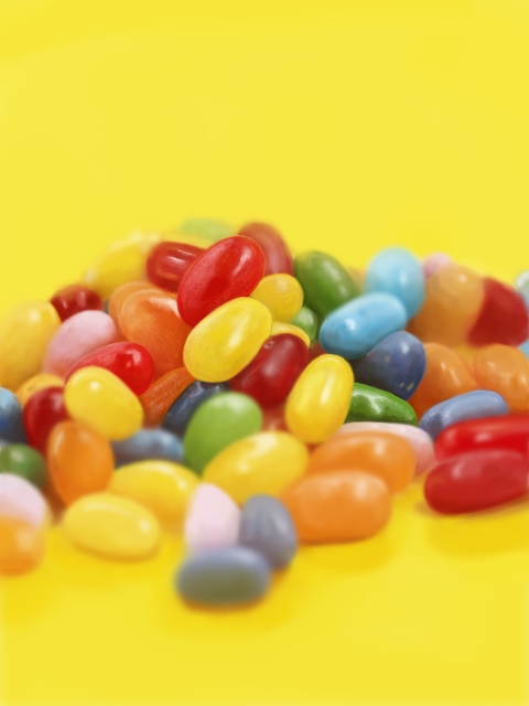 blurry candy commentary_request depth_of_field food food_focus jelly_bean kya4 no_humans original photorealistic shiny still_life yellow_background