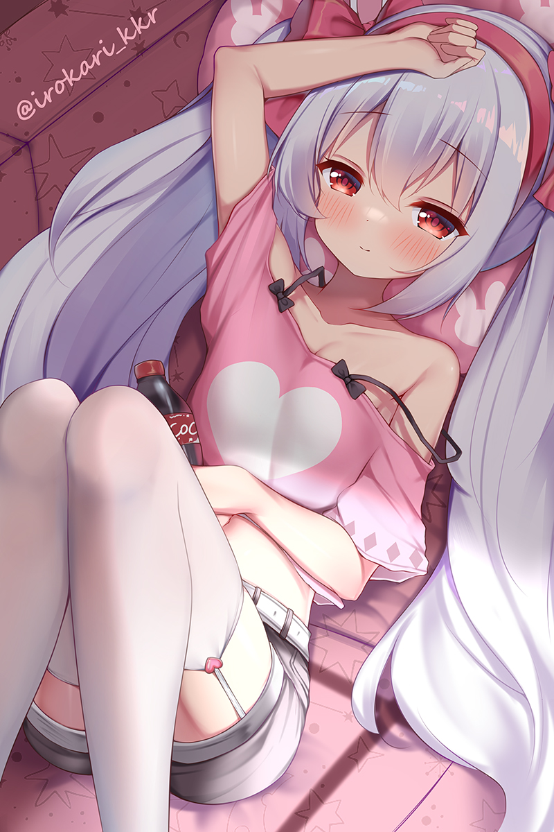 1girl arm_up azur_lane bangs bare_shoulders belt blush bottle bow closed_mouth collarbone commentary couch eyebrows_visible_through_hair feet_out_of_frame garter_straps grey_shorts hair_bow hairband hand_on_own_stomach heart heart_print highres holding holding_bottle irokari knees_up laffey_(azur_lane) long_hair looking_at_viewer lying midriff off-shoulder_shirt off_shoulder on_back on_couch pink_shirt print_shirt red_bow red_eyes shirt short_shorts short_sleeves shorts sidelocks silver_hair smile soda_bottle solo strap_slip thigh-highs twintails twitter_username very_long_hair white_belt white_legwear