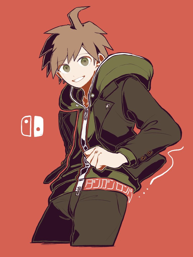 ! 1boy ahoge bangs belt brown_hair brown_jacket brown_pants cowboy_shot cropped_legs dangan_ronpa:_trigger_happy_havoc dangan_ronpa_(series) eyebrows_visible_through_hair green_eyes grin hand_up hood hood_down hoodie jacket kiri_(2htkz) logo looking_at_viewer male_focus naegi_makoto nintendo_switch open_clothes open_jacket pants red_background shirt simple_background smile solo spoken_exclamation_mark