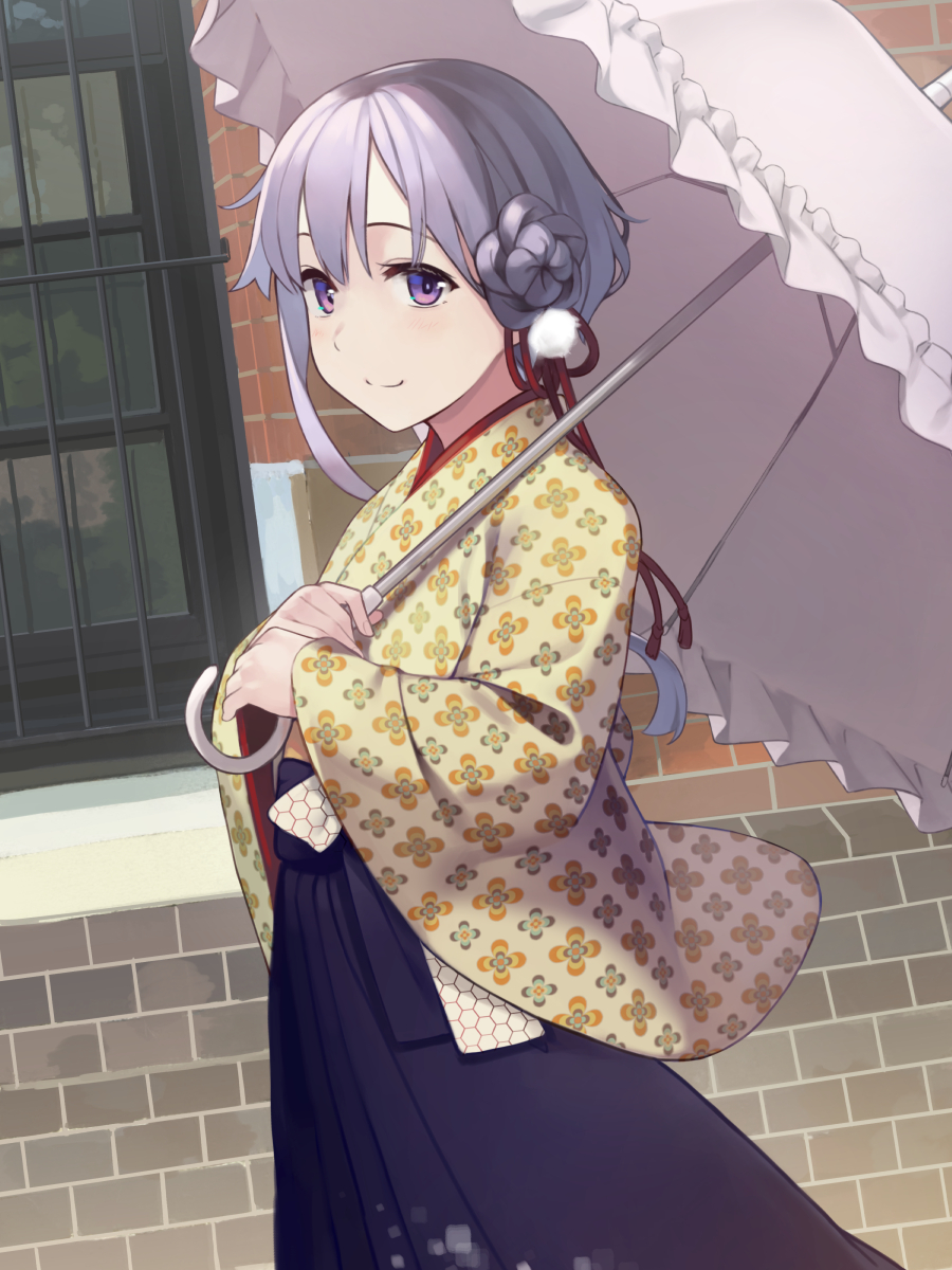 1girl alternate_hairstyle blue_hakama blue_skirt brick_wall commentary dutch_angle floral_print from_side hair_bun hakama highres holding holding_umbrella japanese_clothes kimono kuz looking_at_viewer looking_to_the_side outdoors parasol purple_hair sidelocks skirt smile solo standing umbrella upper_body violet_eyes vocaloid voiceroid window yellow_kimono yuzuki_yukari