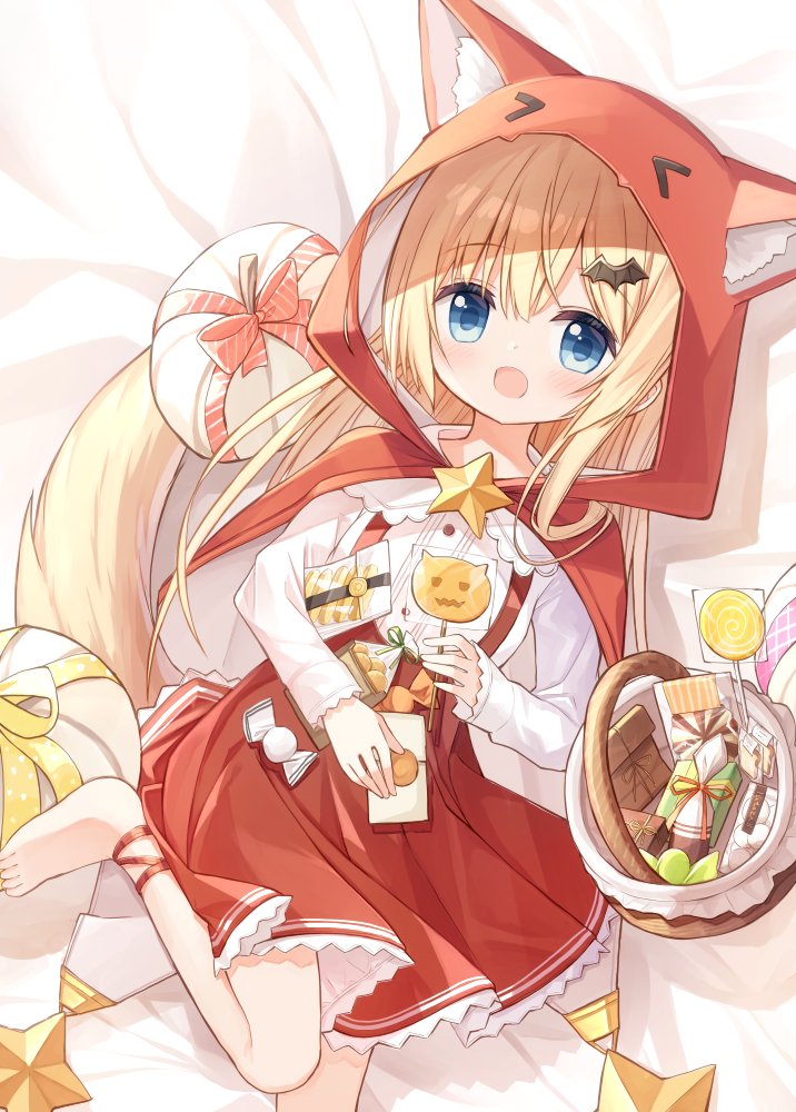 1girl :d animal_ear_fluff animal_ears animal_hood bangs barefoot basket bed_sheet blonde_hair blue_eyes candy capelet commentary_request eyebrows_visible_through_hair fake_animal_ears feet_out_of_frame flower_girl_(yuuhagi_(amaretto-no-natsu)) food hair_between_eyes hair_ornament halloween holding holding_candy holding_food holding_lollipop hood hood_up hooded_capelet lollipop long_sleeves looking_at_viewer lying on_back original pleated_skirt red_capelet red_skirt shirt skirt smile solo suspender_skirt suspenders swirl_lollipop tail white_shirt wolf_tail yuuhagi_(amaretto-no-natsu)