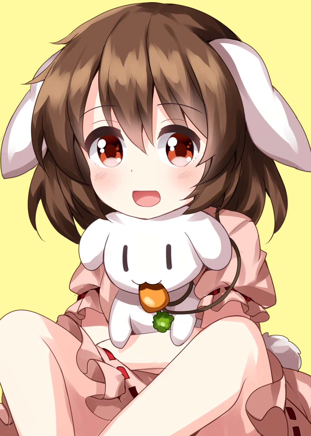 1girl :d animal animal_ears bangs brown_hair carrot_necklace dress eyebrows_visible_through_hair floppy_ears highres holding holding_animal in_mouth inaba_mob_(touhou) inaba_tewi looking_at_viewer open_mouth pink_dress puffy_short_sleeves puffy_sleeves rabbit rabbit_ears rabbit_tail ruu_(tksymkw) short_hair short_sleeves simple_background sitting smile solid_oval_eyes tail touhou yellow_background