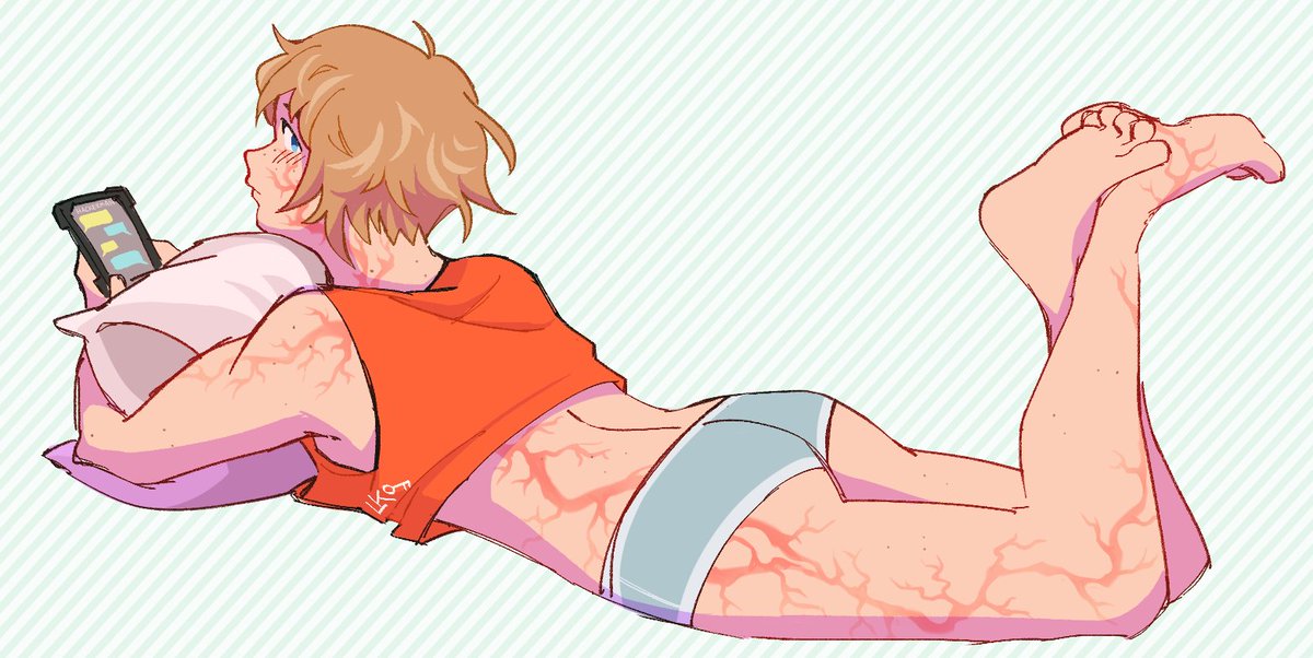 1girl apex_legends ass barefoot blonde_hair blue_eyes blue_shorts crop_top english_commentary freckles from_side holding holding_phone lila_(lilakeylk) looking_at_viewer looking_back lying on_stomach orange_shirt phone pillow scar scar_on_arm scar_on_back scar_on_cheek scar_on_face scar_on_leg shirt short_hair short_shorts shorts soles solo wattson_(apex_legends)