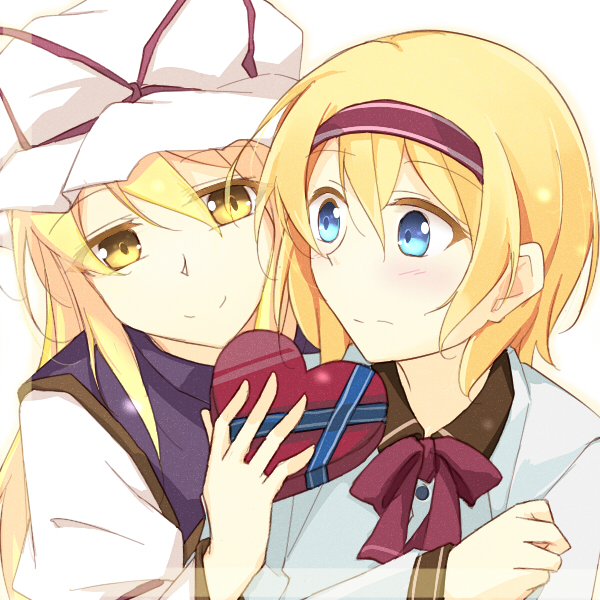 2girls alice_margatroid bangs blonde_hair blouse blue_blouse blue_eyes blush bow bowtie box brown_shirt buttons chocolate closed_mouth collared_shirt commentary_request dress eyebrows_visible_through_hair eyes_visible_through_hair faech food hair_between_eyes hairband hand_up hat hat_bow heart juliet_sleeves long_hair long_sleeves looking_at_another mob_cap multiple_girls puffy_sleeves purple_bow purple_bowtie purple_hairband purple_vest red_heart shirt simple_background smile tabard touhou upper_body vest white_background white_dress white_headwear wide_sleeves yakumo_yukari yellow_eyes yuri