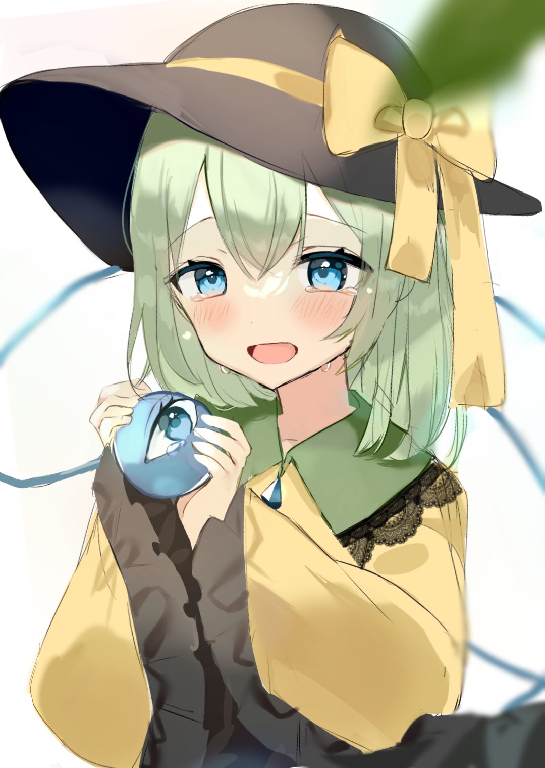 1girl black_headwear blue_eyes blush bow crying crying_with_eyes_open eyebrows_visible_through_hair frilled_shirt_collar frilled_sleeves frills green_hair hair_between_eyes happy_tears hat hat_bow heart highres holding komeiji_koishi long_sleeves looking_down open_mouth ribbon shirt solo tears third_eye touhou upper_body wide_sleeves yellow_bow yellow_ribbon yellow_shirt yumeno_ruruka