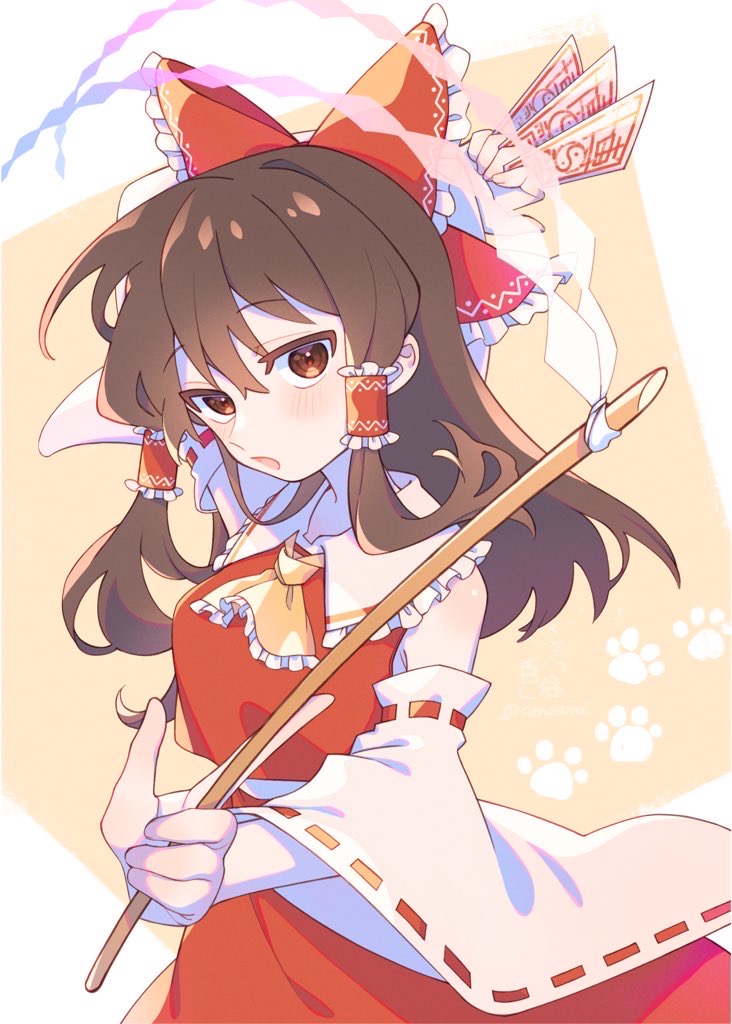 1girl arm_up ascot bangs bare_shoulders between_fingers blush bow brown_eyes brown_hair collarbone commentary_request detached_sleeves e_sdss frilled_bow frilled_hair_tubes frills gohei hair_bow hair_tubes hakurei_reimu holding holding_stick long_hair long_sleeves looking_at_viewer nontraditional_miko ofuda open_mouth paw_print paw_print_background red_bow red_skirt red_vest ribbon-trimmed_sleeves ribbon_trim sidelocks skirt solo stick touhou vest wide_sleeves yellow_ascot