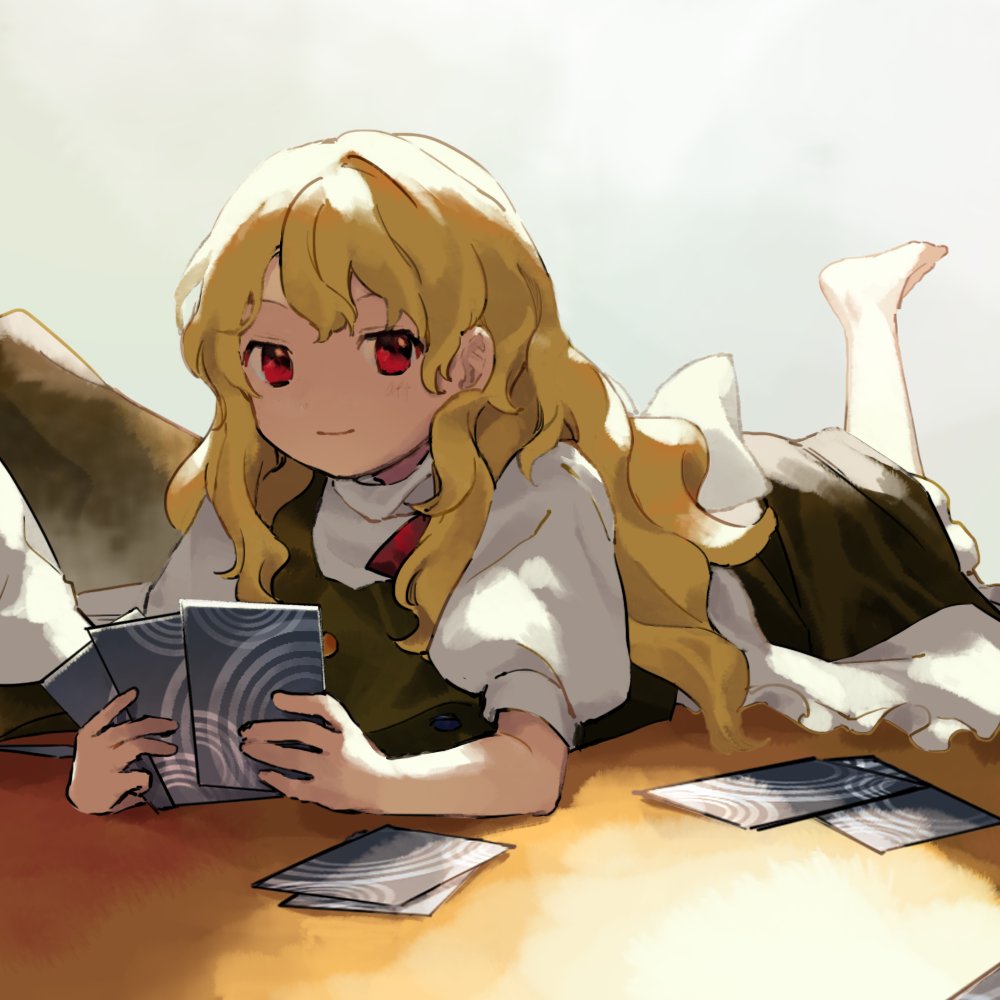 100th_black_market 1girl ability_card_(touhou) apron barefoot black_skirt black_vest blonde_hair card closed_mouth commentary_request frilled_apron frilled_skirt frills happy holding holding_card kaigen_1025 kirisame_marisa leg_up long_hair looking_at_viewer lying no_headwear no_shoes on_stomach puffy_short_sleeves puffy_sleeves red_eyes red_ribbon ribbon shirt short_sleeves skirt skirt_set smile solo touhou turtleneck very_long_hair vest waist_apron wavy_hair white_apron white_shirt