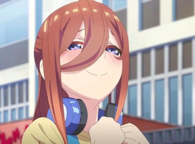 1girl blue_eyes blurry blurry_background blush brown_hair depth_of_field go-toubun_no_hanayome hair_between_eyes headphones headphones_around_neck library long_hair nakano_miku ponytail redhead smile