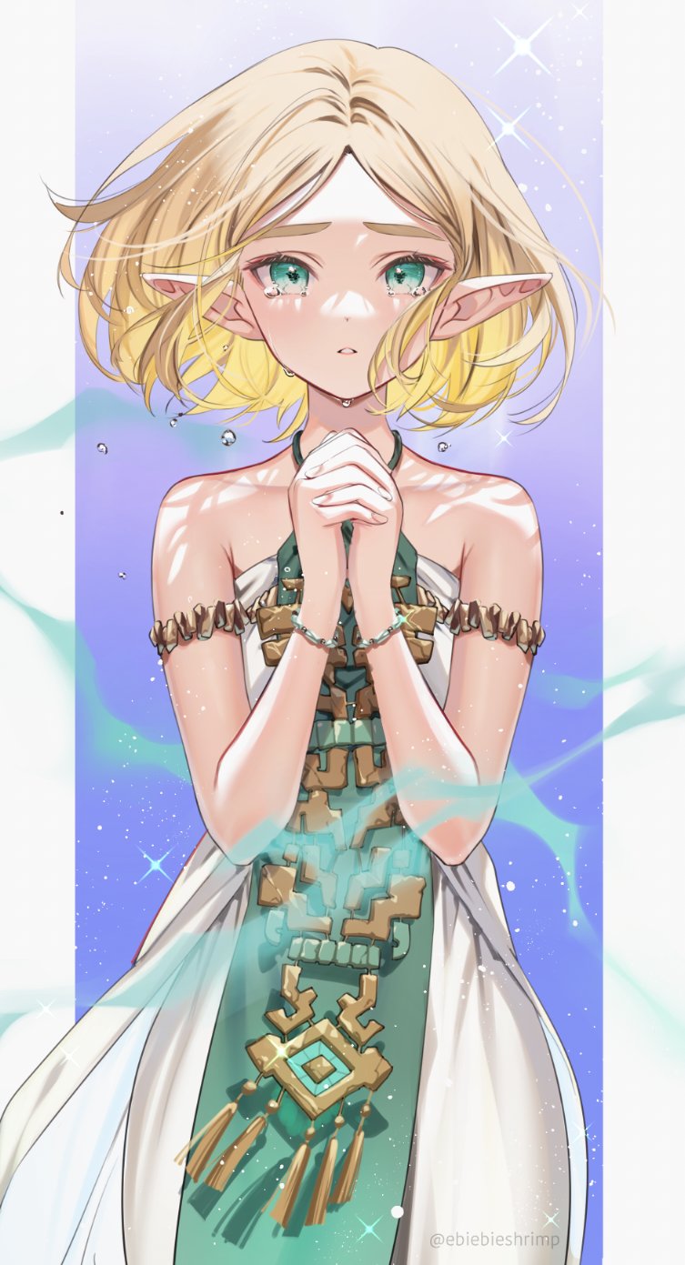 1girl armlet bangs bare_shoulders blonde_hair blush bracelet crying crying_with_eyes_open dress forehead green_eyes highres interlocked_fingers jewelry looking_at_viewer own_hands_clasped own_hands_together parted_bangs parted_lips pointy_ears princess_zelda short_hair shuri_(84k) sleeveless sleeveless_dress solo tears the_legend_of_zelda the_legend_of_zelda:_breath_of_the_wild the_legend_of_zelda:_tears_of_the_kingdom thick_eyebrows twitter_username white_dress