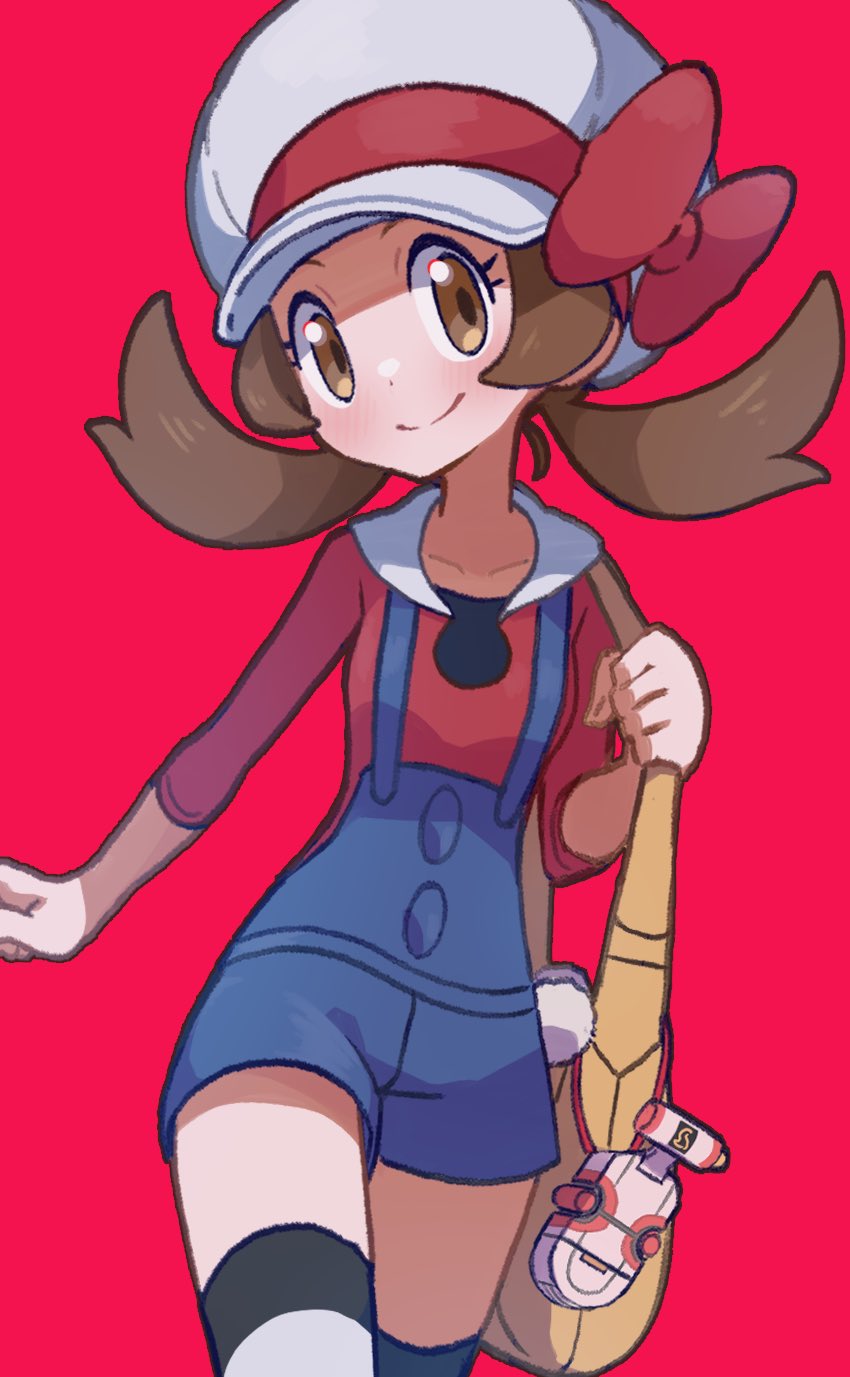 1girl blue_overalls bow brown_eyes brown_hair cabbie_hat closed_mouth collarbone hat highres hiisu_(s-1104-d) holding_strap looking_at_viewer low_twintails lyra_(pokemon) overalls pokegear pokemon pokemon_(game) pokemon_hgss red_background red_bow red_shirt shirt smile thigh-highs twintails yellow_bag