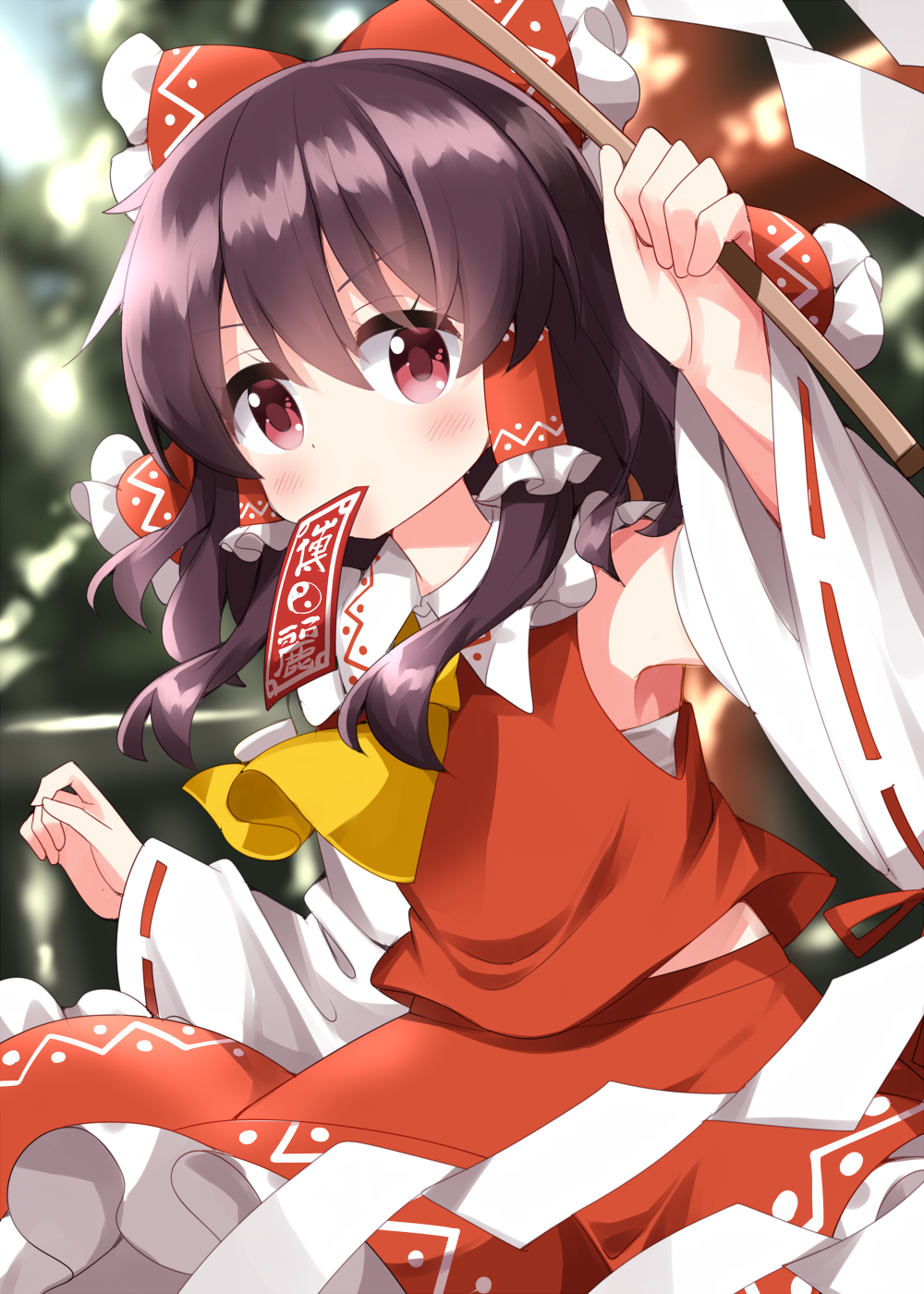 1girl arm_up armpit_peek armpits ascot blurry blurry_background bow day detached_sleeves flat_chest frilled_bow frilled_hair_tubes frills gohei hair_bow hair_tubes hakurei_reimu highres holding holding_stick midriff_peek mouth_hold ofuda outdoors petite red_bow red_skirt ribbon-trimmed_sleeves ribbon_trim ruu_(tksymkw) serious skirt solo stick touhou v-shaped_eyebrows wide_sleeves yellow_ascot
