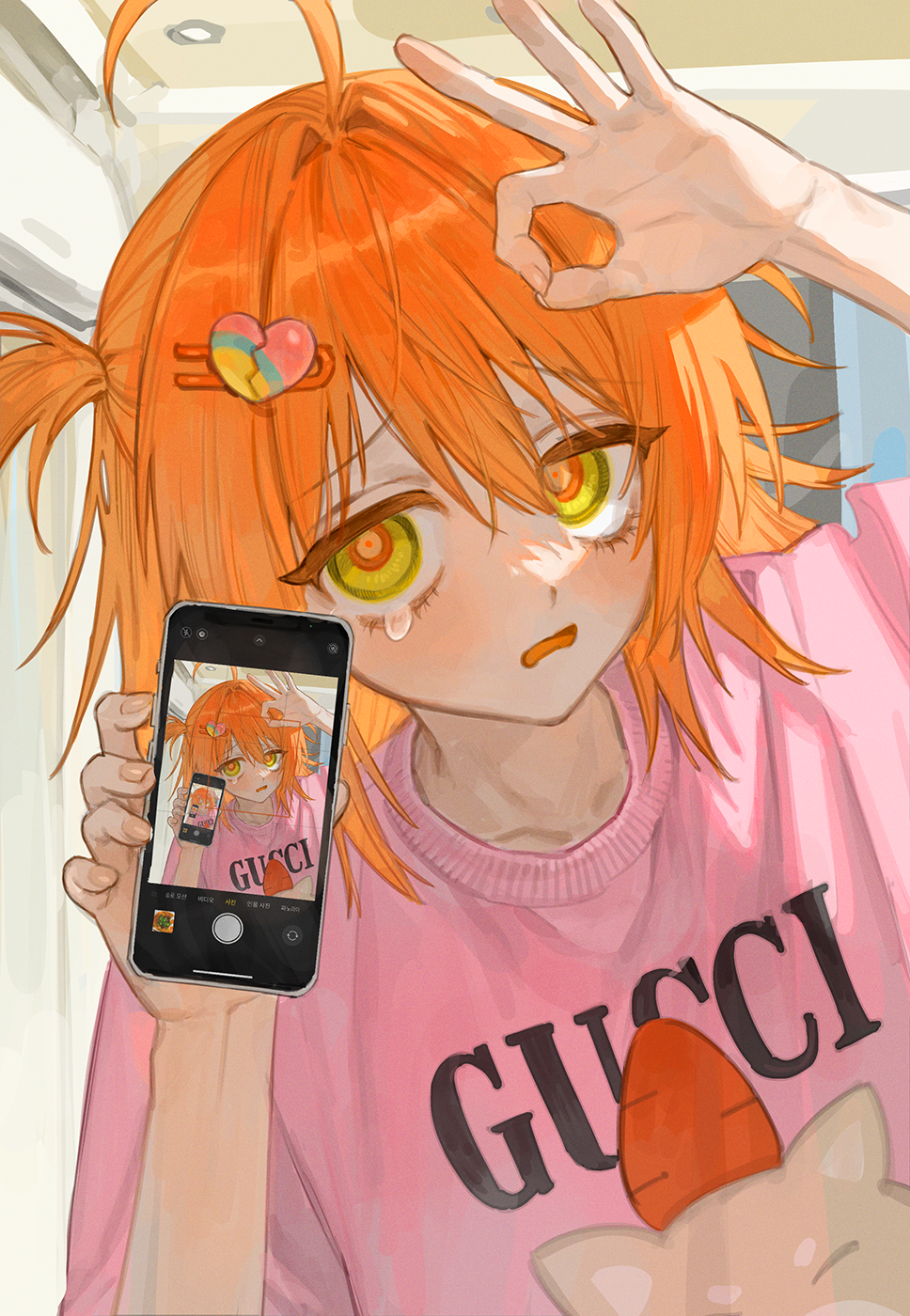 1girl ahoge blush can_lights cellphone cellphone_picture collarbone dutch_angle frost_fog furrowed_brow hair_between_eyes hair_intakes hair_ornament hairclip hand_up heart heart_hair highres holding holding_phone indoors long_hair long_sleeves looking_at_viewer ok_sign one_side_up open_mouth orange_eyes orange_hair original phone pink_shirt print_shirt product_placement ringed_eyes selfie shirt smartphone solo tearing_up upper_body yellow_eyes