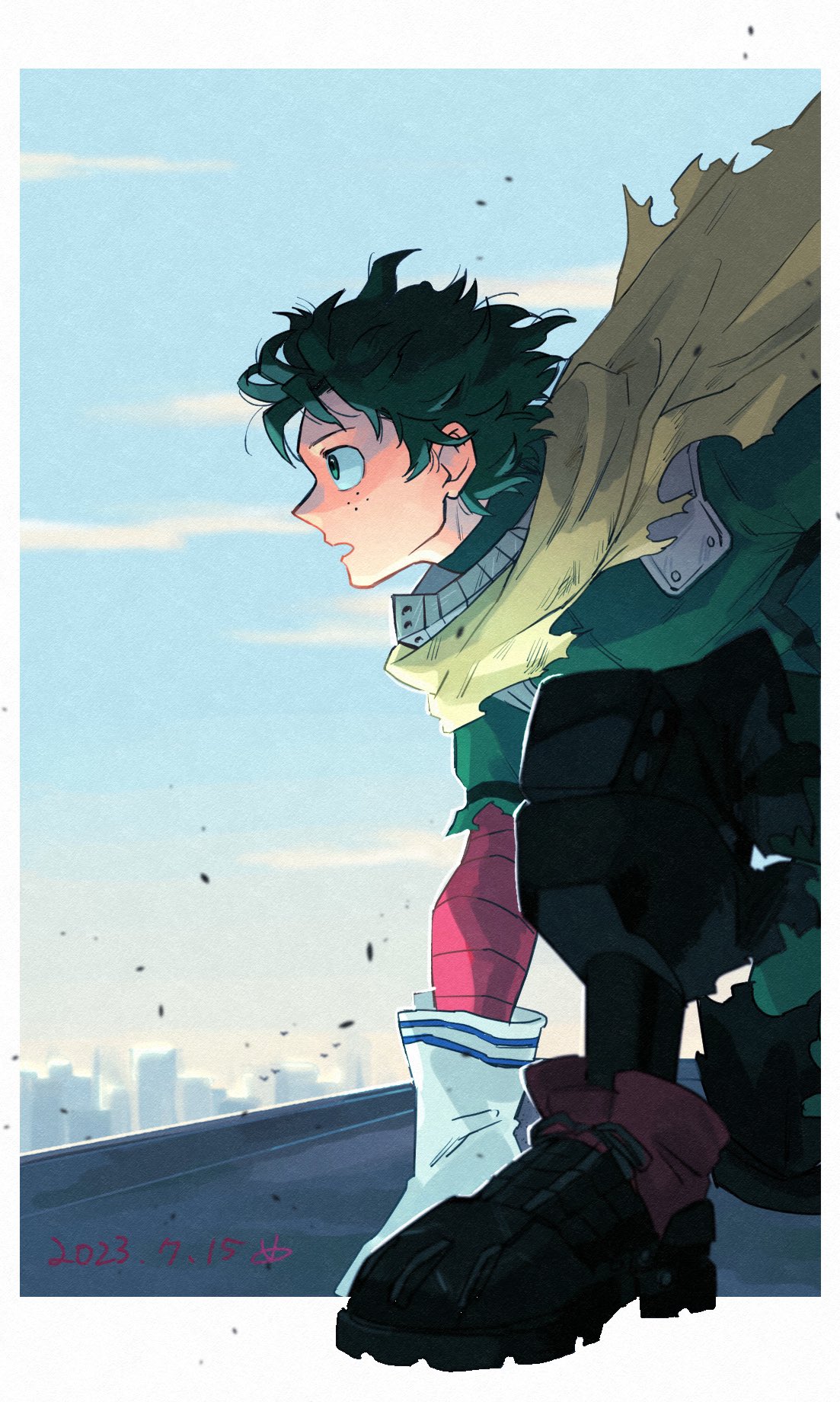 1boy black_footwear black_pants boku_no_hero_academia border cape freckles gloves green_eyes green_hair highres male_focus meld_me midoriya_izuku on_one_knee open_mouth pants rooftop short_hair solo torn_cape torn_clothes white_border white_gloves yellow_cape