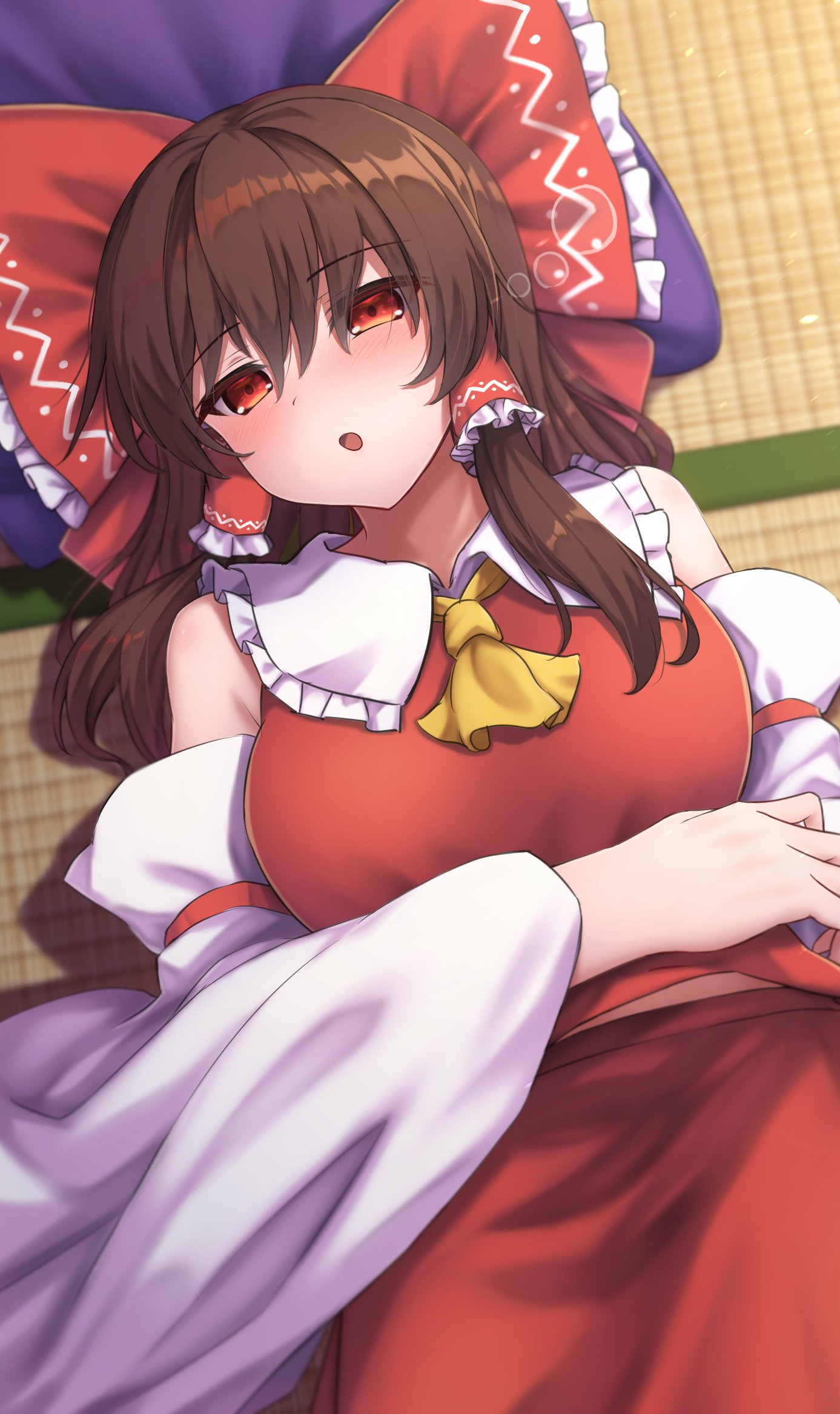 1girl arm_under_breasts ascot bare_shoulders blush bow brown_hair commentary cowboy_shot detached_sleeves frilled_bow frilled_hair_tubes frilled_shirt_collar frills hair_between_eyes hair_bow hair_spread_out hair_tubes hakurei_reimu head_on_pillow head_tilt highres huge_bow indoors long_hair long_sleeves looking_at_viewer lying on_back open_mouth pillow red_bow red_eyes red_shirt red_skirt shirt sidelocks skirt sleepy sleeveless sleeveless_shirt solo straight_hair tatami touhou wide_sleeves yellow_ascot yosshy