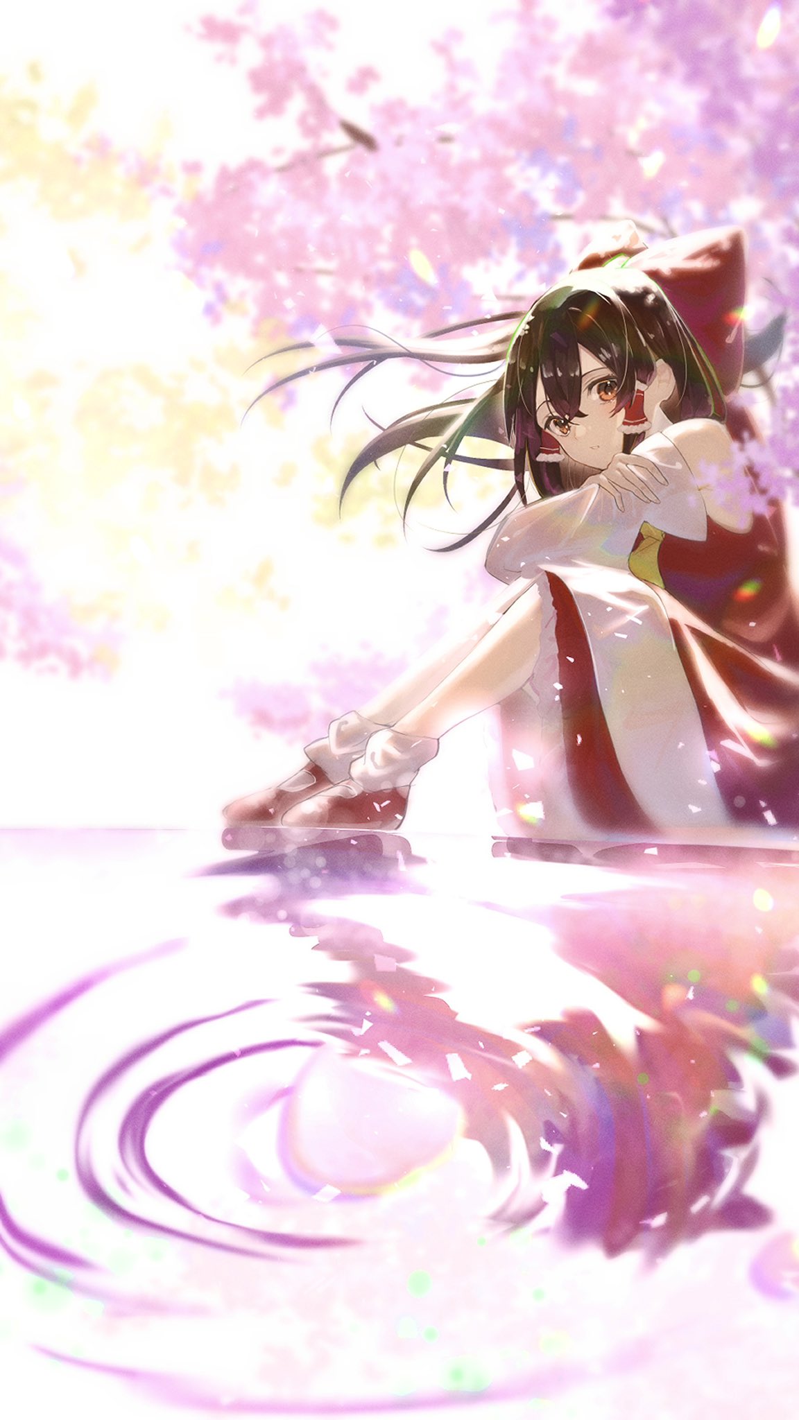 1girl ascot bow brown_eyes brown_hair cherry_blossoms commentary_request detached_sleeves frilled_hair_tubes frills hair_bow hair_tubes hakurei_reimu highres long_hair misohiyu3935 pink_petals red_bow red_skirt ripples sitting skirt skirt_set solo touhou water yellow_ascot