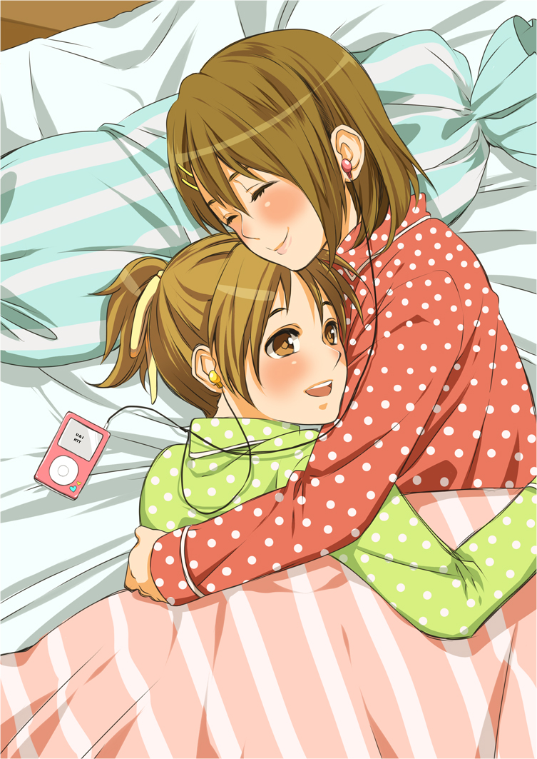 bed blush brown_eyes brown_hair digital_media_player earphones hair_ornament hair_ribbon hairclip hirasawa_ui hirasawa_yui hug ipod k-on! kusaka_(starride) multiple_girls pajamas polka_dot ponytail ribbon siblings sisters smile