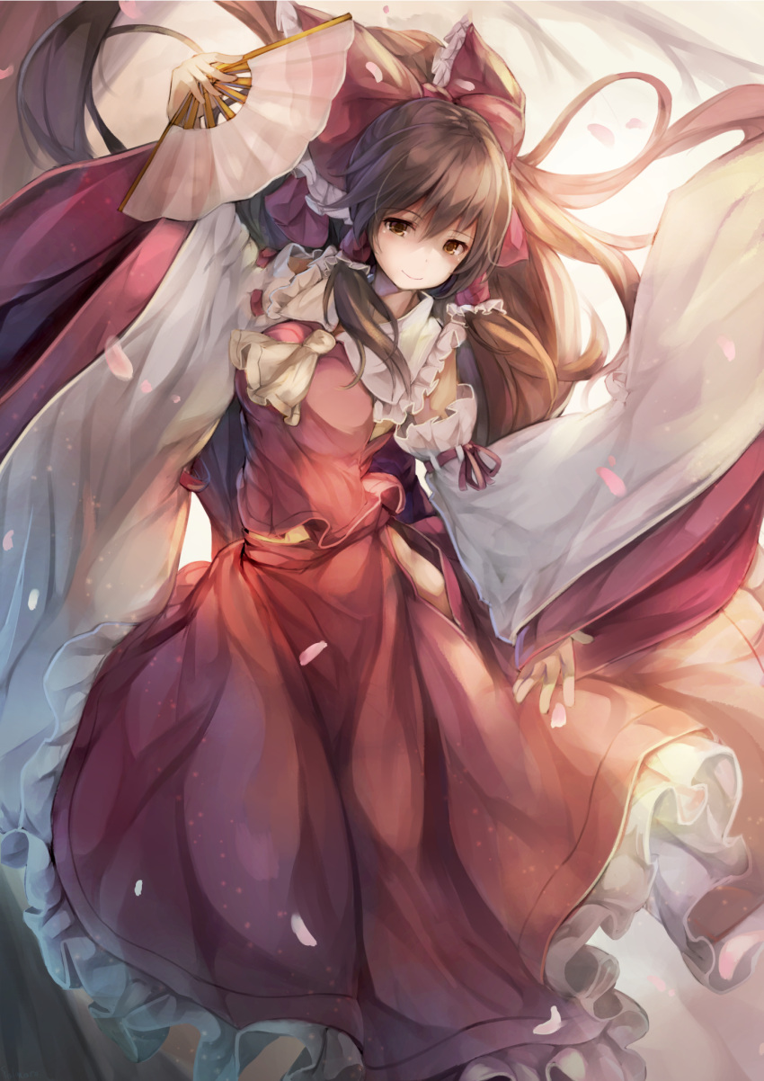 1girl adapted_costume ascot bow brown_eyes brown_hair detached_sleeves embellished_costume fal_maro fan folding_fan frilled_skirt hair_bow hair_tubes hakurei_reimu highres holding long_hair skirt smile solo touhou wide_sleeves