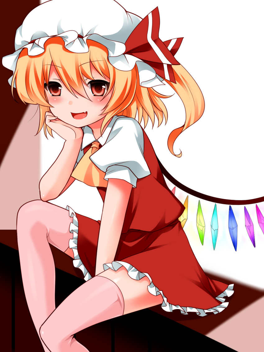 1girl blonde_hair blush elbow_rest fang flandre_scarlet hat highres kitarow pink_legwear red_eyes side_ponytail smile solo thigh-highs touhou wings