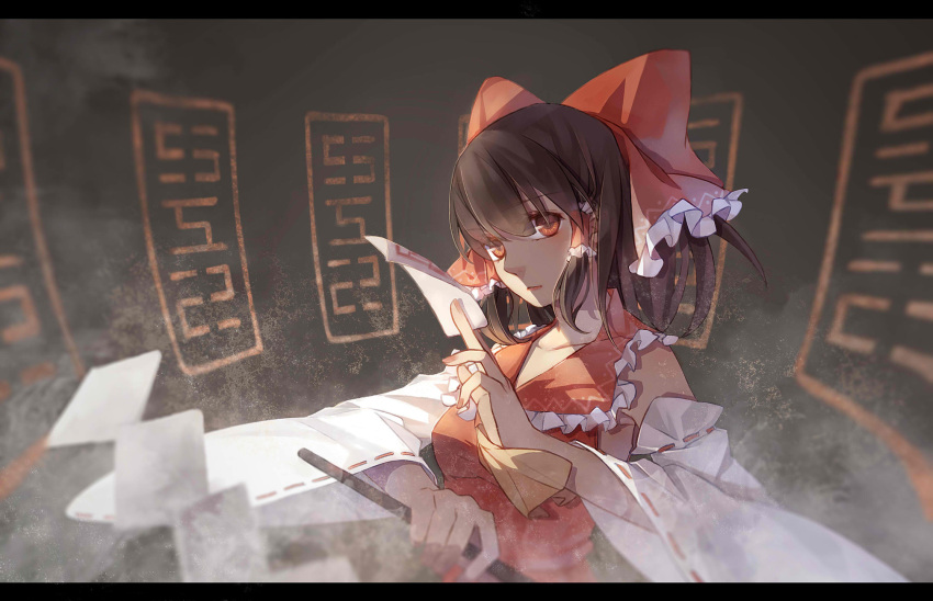 1girl bow brown_hair bust detached_sleeves dress gohei hair_bow hair_tubes hakurei_reimu highres letterboxed long_sleeves looking_at_viewer momozi_(mkingnight) red_dress red_eyes shaded_face solo spell_card touhou wide_sleeves