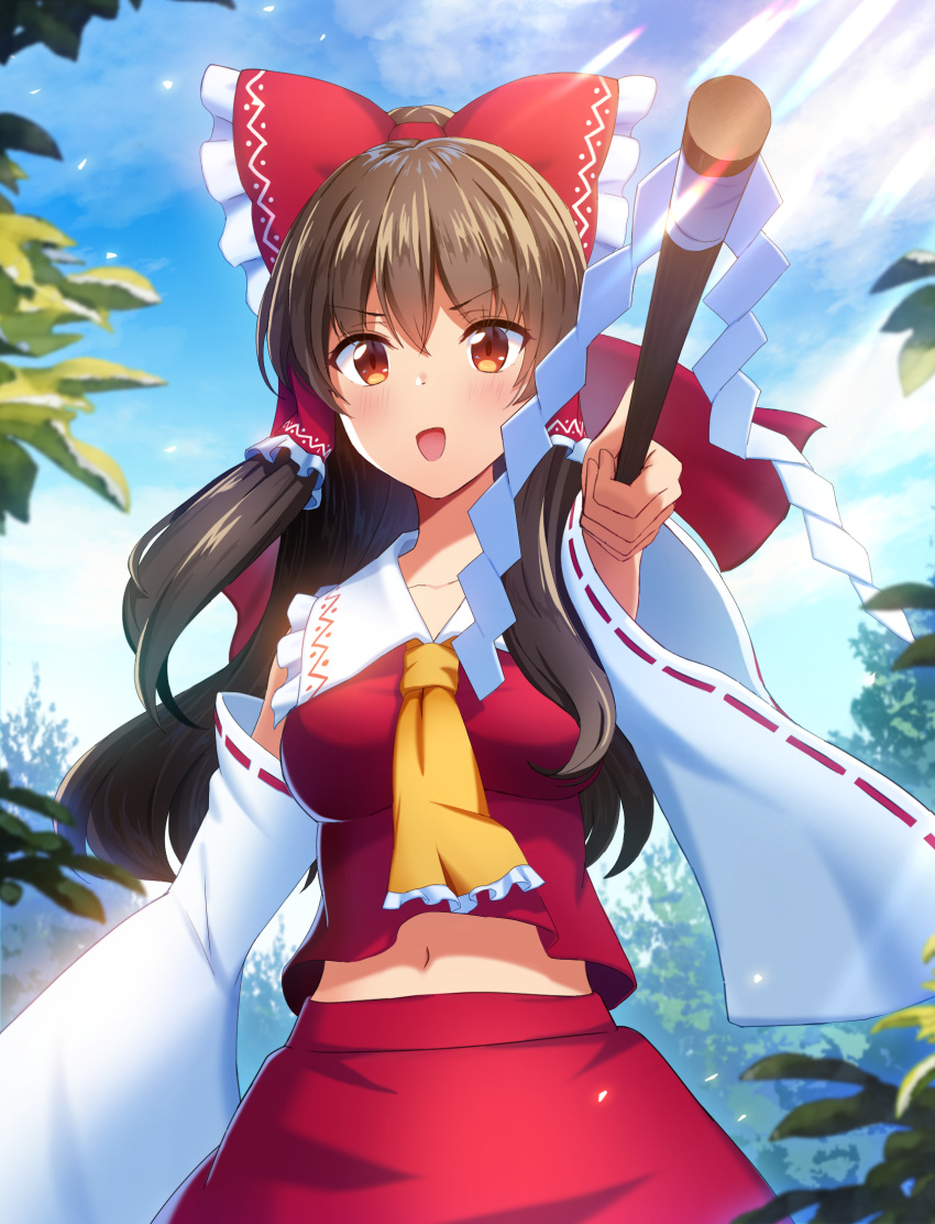 1girl :d arm_up ascot bangs blurry bow brown_eyes brown_hair clouds cloudy_sky commentary_request day depth_of_field detached_sleeves eyebrows_visible_through_hair foreshortening frilled_bow frilled_hair_tubes frilled_shirt_collar frills gohei hair_between_eyes hair_bow hair_tubes hakurei_reimu highres holding holding_stick leaf light_blush light_particles long_hair long_sleeves looking_at_viewer midriff mikomiko_(mikomikosu) navel open_mouth outdoors red_bow red_skirt red_vest sidelocks skirt skirt_set sky smile solo stick touhou v-shaped_eyebrows vest wide_sleeves yellow_neckwear