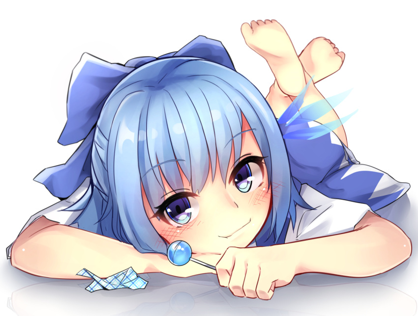 1girl barefoot blue_dress blue_eyes blue_hair blush candy cirno dress ice ice_wings legs_up lollipop lying on_stomach shirt short_sleeves smirk solo toku_0012 touhou wings