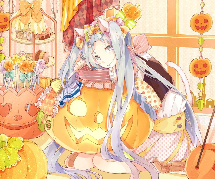 1girl animal_ears blue_eyes blue_hair candy cat_ears cat_tail detached_sleeves fangs halloween hatsune_miku jack-o'-lantern lollipop long_hair looking_at_viewer manako_(manatera) sitting smile solo tail twintails very_long_hair vocaloid