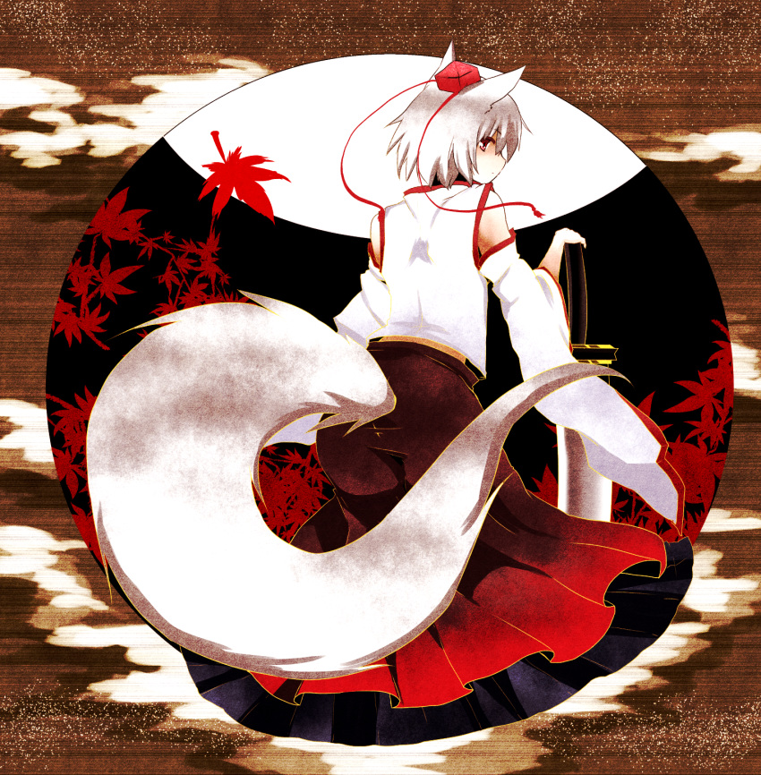 1girl animal_ears autumn_leaves bare_shoulders detached_sleeves hat highres inubashiri_momiji leaf looking_at_viewer looking_back nayutaro red_eyes short_hair silver_hair solo sword tail tokin_hat touhou weapon wolf_ears wolf_tail