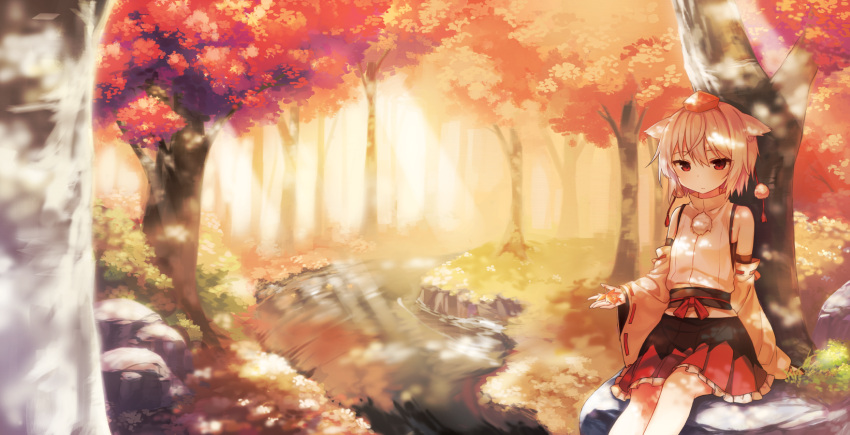 1girl against_tree animal_ears autumn autumn_leaves bare_shoulders dappled_sunlight detached_sleeves forest hat hat_removed headwear_removed highres inubashiri_momiji long_sleeves nature pom_pom_(clothes) red_eyes river sash shinoba shirt sitting skirt solo tokin_hat touhou tree wide_sleeves wolf_ears