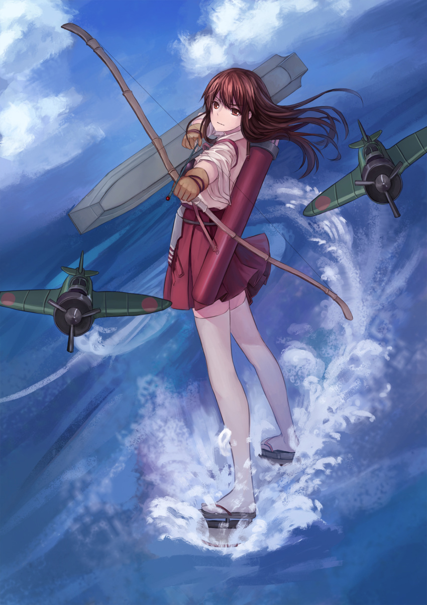 1girl aiming aiming_at_viewer airplane akagi_(kantai_collection) archery arrow blue_sky bow_(weapon) brown_eyes brown_hair clouds drawing_bow flight_deck full_body hakama_skirt highres kantai_collection long_hair looking_at_viewer muneate ocean outdoors pleated_skirt quiver red_skirt skirt sky solo standing tasuki thigh-highs weapon white_legwear youxuemingdie yugake zettai_ryouiki