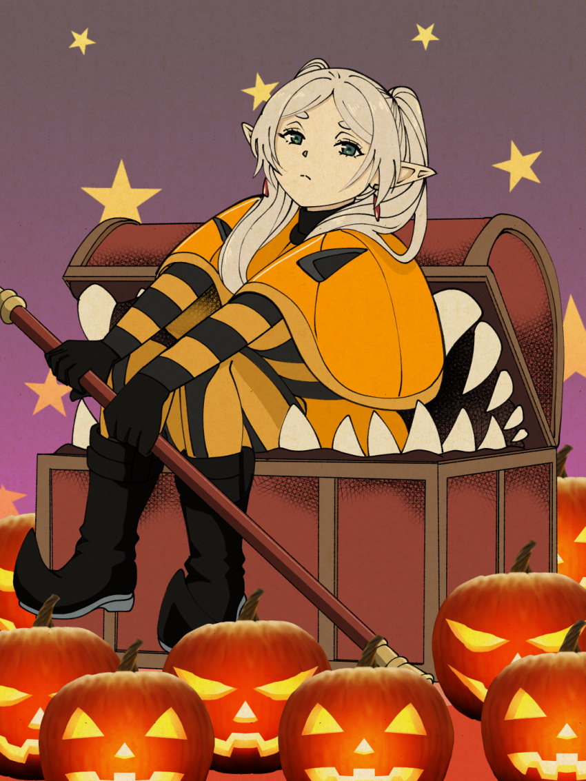 1girl a-king black_gloves boots capelet earrings elf frieren gloves green_eyes halloween highres holding holding_staff jack-o'-lantern jewelry madhouse_(studio) mage_staff mimic mimic_chest pointy_ears sharp_teeth shogakukan sitting solo sousou_no_frieren staff star_(symbol) teeth treasure_chest twintails white_hair