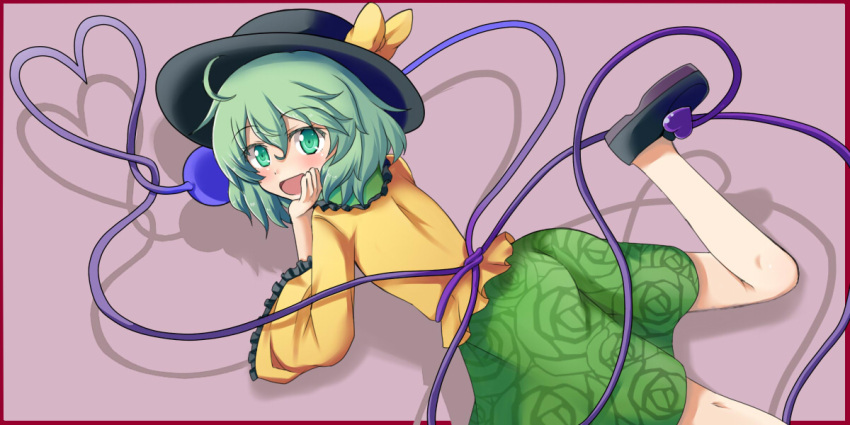 1girl blush bow commentary_request elbow_rest green_eyes green_hair hat hat_bow heart heart_of_string komeiji_koishi leg_lift looking_back lying mono_(mono60) on_stomach open_mouth solo third_eye touhou