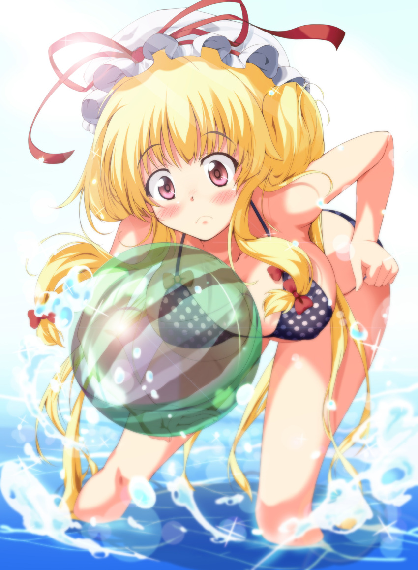 1girl bent_over bikini blonde_hair blue_sky blurry blush bow breasts clouds depth_of_field embarrassed eyebrows_visible_through_hair hair_bow hair_up hand_on_hip hat hat_ribbon highres hips holding_ball large_breasts lens_flare light_particles light_rays long_hair mob_cap nanase_nanami ocean partially_submerged polka_dot polka_dot_bikini polka_dot_swimsuit ribbon sky solo sparkle splashing standing summer sunlight swimsuit thighs touhou transparent very_long_hair violet_eyes water yakumo_yukari