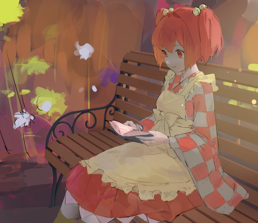 1girl apron bangs bell bench book bow closed_mouth commentary_request dress hair_bell hair_between_eyes hair_bow hair_ornament highres long_sleeves motoori_kosuzu open_book orange_dress orange_hair park_bench pikumin reading red_eyes short_hair short_twintails sitting smile solo touhou twintails wide_sleeves yellow_apron