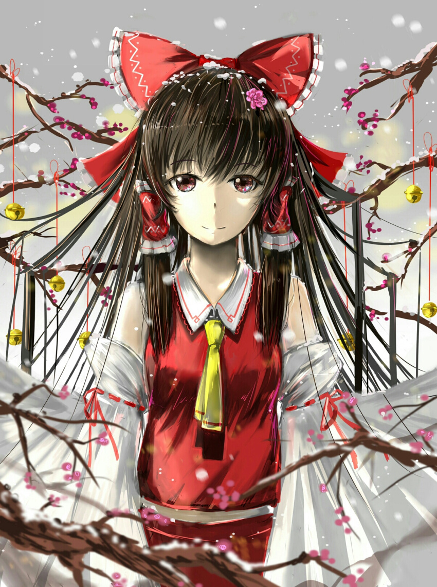 1girl ascot bell blurry bow brown_eyes brown_hair commentary_request cowboy_shot depth_of_field detached_sleeves frilled_bow frills grey_sky hair_bow hair_tubes hakurei_reimu highres light light_particles long_hair looking_at_viewer luomo red_skirt reflective_eyes ribbon ribbon-trimmed_sleeves ribbon_trim skirt sleeveless small_breasts smile snow snowing solo touhou tree_branch wide_sleeves winter