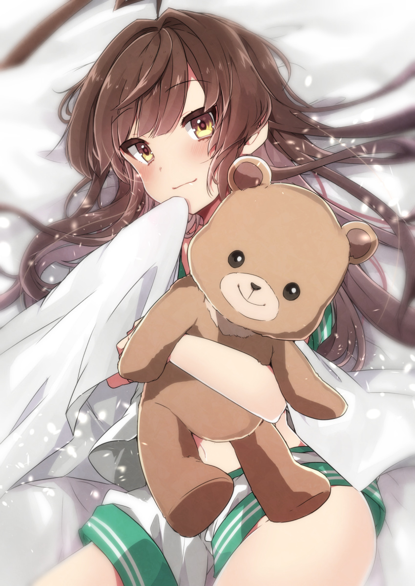 1girl ahoge bear blanket blush brown_eyes brown_hair commentary_request highres hug kantai_collection kuma_(kantai_collection) long_hair looking_at_viewer lying object_hug on_back pillow school_uniform serafuku shorts smile stuffed_animal stuffed_toy tagme takeshima_(nia) teddy_bear