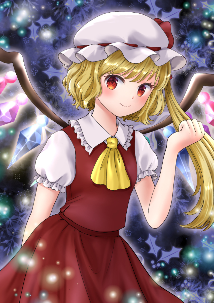 1girl ascot bangs blonde_hair blue_background blush breasts closed_mouth cowboy_shot crystal eyebrows_hidden_by_hair flandre_scarlet frilled_shirt_collar frills glowing hand_up hat highres kyabekko looking_at_viewer mob_cap one_side_up puffy_short_sleeves puffy_sleeves red_eyes red_skirt red_vest short_hair_with_long_locks short_sleeves simple_background skirt skirt_set small_breasts smile solo touhou vest white_headwear wings yellow_ascot