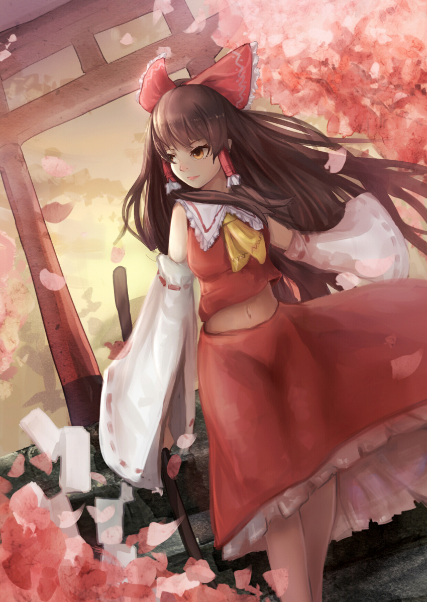 1girl ascot bow breasts brown_eyes brown_hair cherry_blossoms cowboy_shot detached_sleeves gohei hair_bow hair_tubes hakurei_reimu highres long_hair looking_to_the_side midriff outdoors pantie_painting petals ribbon-trimmed_sleeves ribbon_trim skirt skirt_set sleeves_past_wrists solo standing torii touhou wide_sleeves wind wind_lift yellow_sky