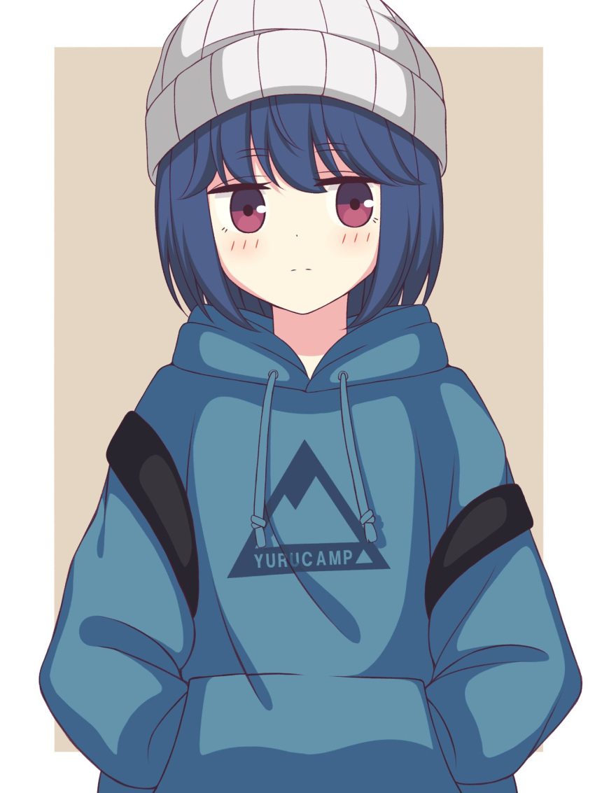 1girl bangs beanie beige_background blue_hair blue_hoodie blush border closed_mouth clothes_writing commentary copyright_name expressionless eyebrows_visible_through_hair hands_in_pockets hat highres hood hood_down hoodie jitome looking_at_viewer medium_hair outside_border print_hoodie shima_rin simple_background solo upper_body violet_eyes white_border white_headwear yurucamp zeta_(24904340)